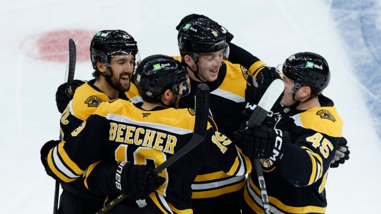 Bruins center Mark Kastelic (47), center Johnny Beecher (19), defenseman Mason Lohrei (6) and left wing Cole Koepke (45) celebrate Kastelic’s goal against the Florida Panthers during the first period at TD Garden.