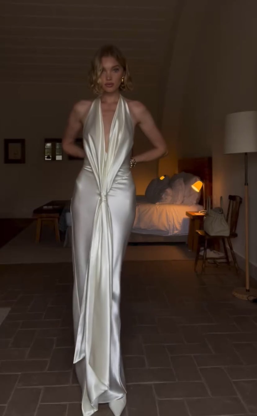 Elsa Hosk wears a plunging white dress.