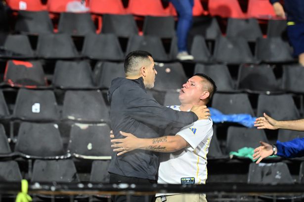 Ex-Barca and Argentina legend tries to stop riot as police fire tear gas into stands