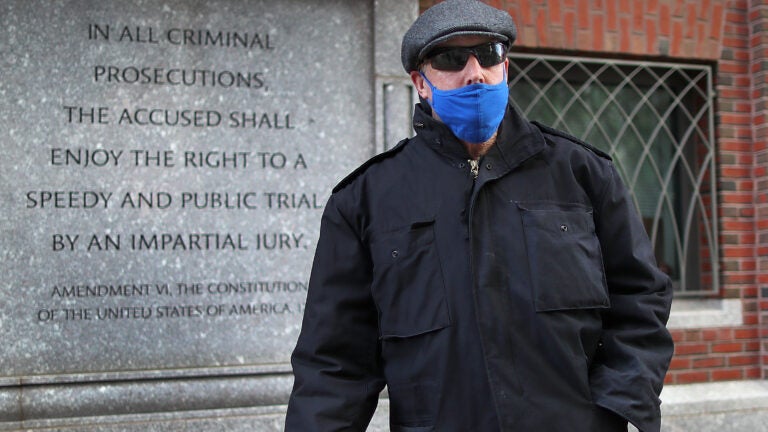 Retired Boston Police Captain Richard Evans leaves Moakley Federal Court.