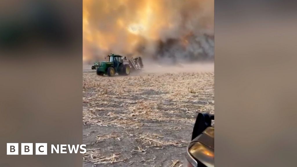 Farmers seen fleeing Nebraska wildfire during harvest