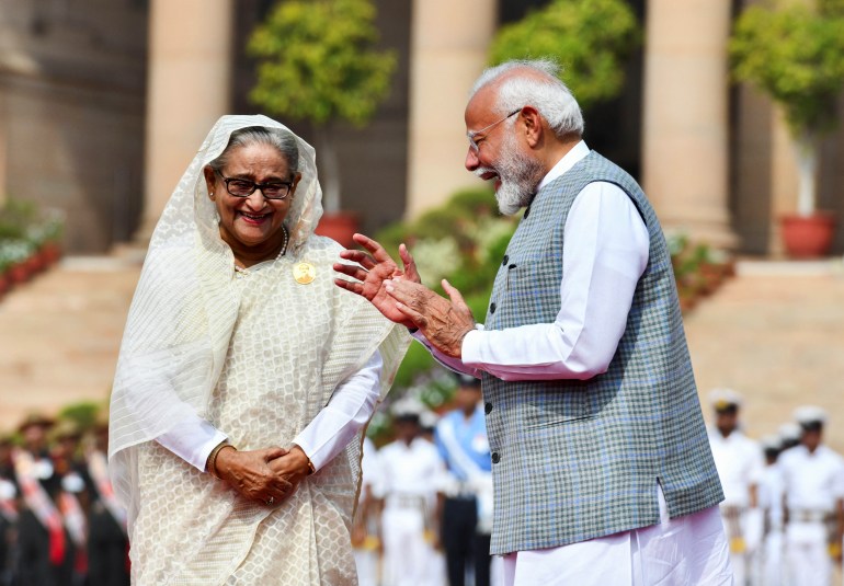 India's Prime Minister Narendra Modi speaks with Bangladesh's Prime Minister Sheikh Hasina during her ceremonial reception at the Forecourt of India's Rashtrapati Bhavan Presidential Palace, in New Delhi, India