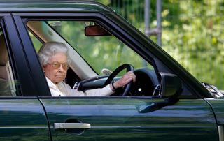 Queen Elizabeth II seen driving her Range Rover car as she watches the International Carriage Driving Grand Prix event on day 4 of the Royal Windsor Horse Show at Home Park on May 17, 2014 in Windsor, England.