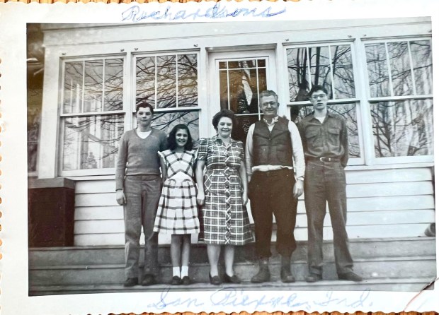 Married early life educators Ralph and Jan Richardson are shown center, with their children Danny and Donna, left, and Jack, far right, in an undated late 1940s photo taken in front of their home in San Pierre, Indiana. (Photo courtesy of the Richardson Family)