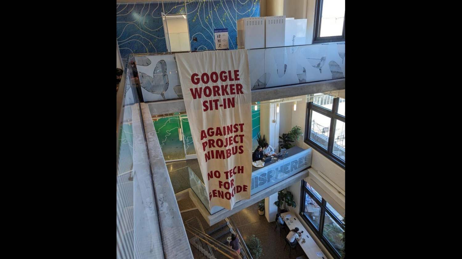 Google workers unfurl banner during sit-in at the company's Manhattan office (Supplied)