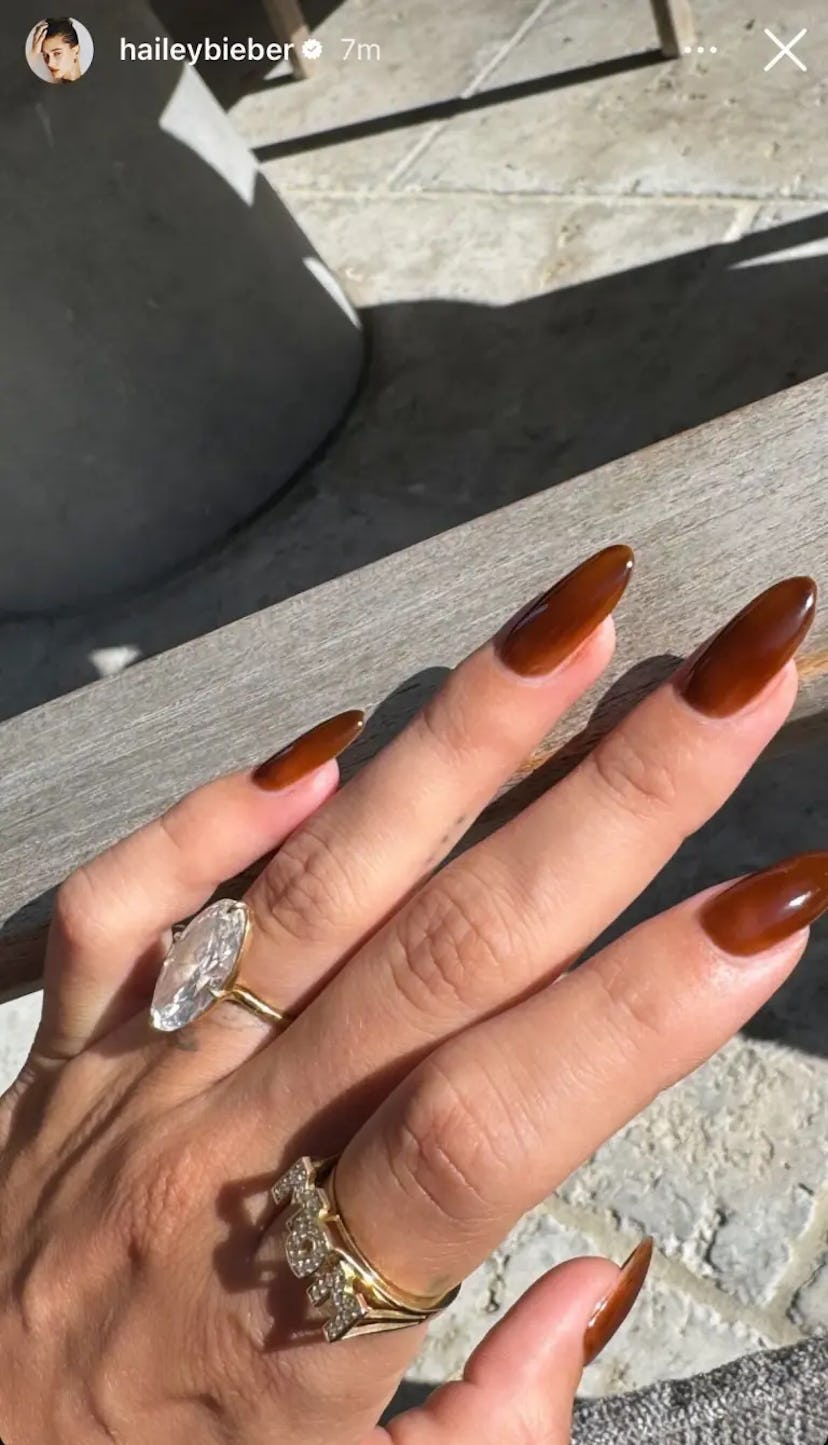 Hailey Bieber showed off a "mom" ring to mark her new role as a mom.