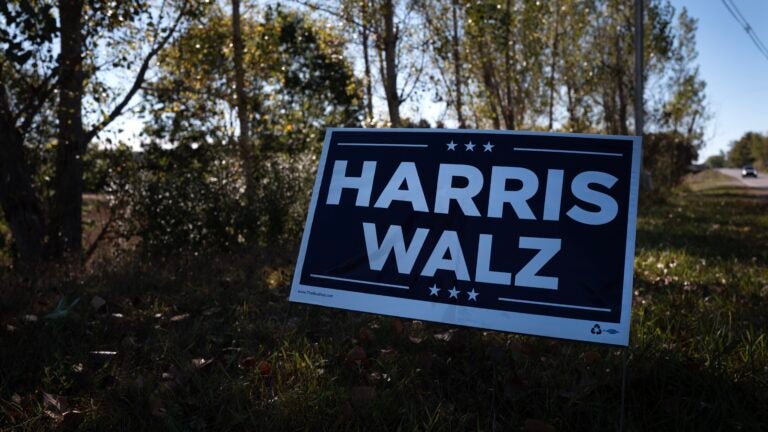 Harris, Warren signs set on fire outside Mass. home