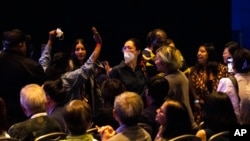 FILE - Pro-Palestinian activists are removed as Vice President Kamala Harris speaks at an Asian and Pacific Islander town hall, July 13, 2024, in Philadelphia. Her campaign has sought to build support with communities angered by the U.S. response to Gaza and Lebanon conflicts.