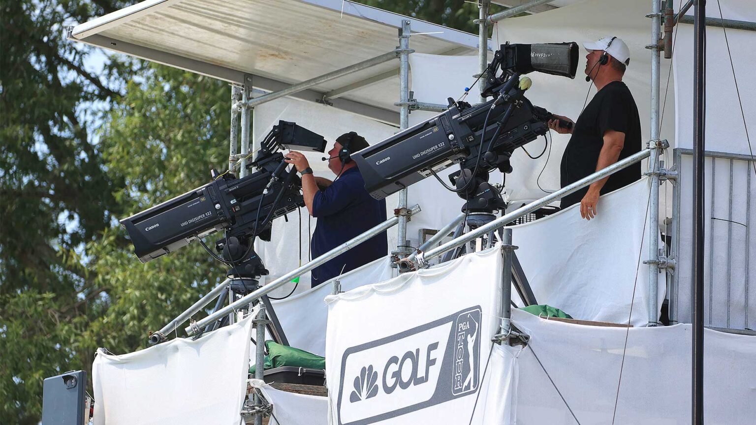 pga tour cameras point down at the action under a golf channel logo