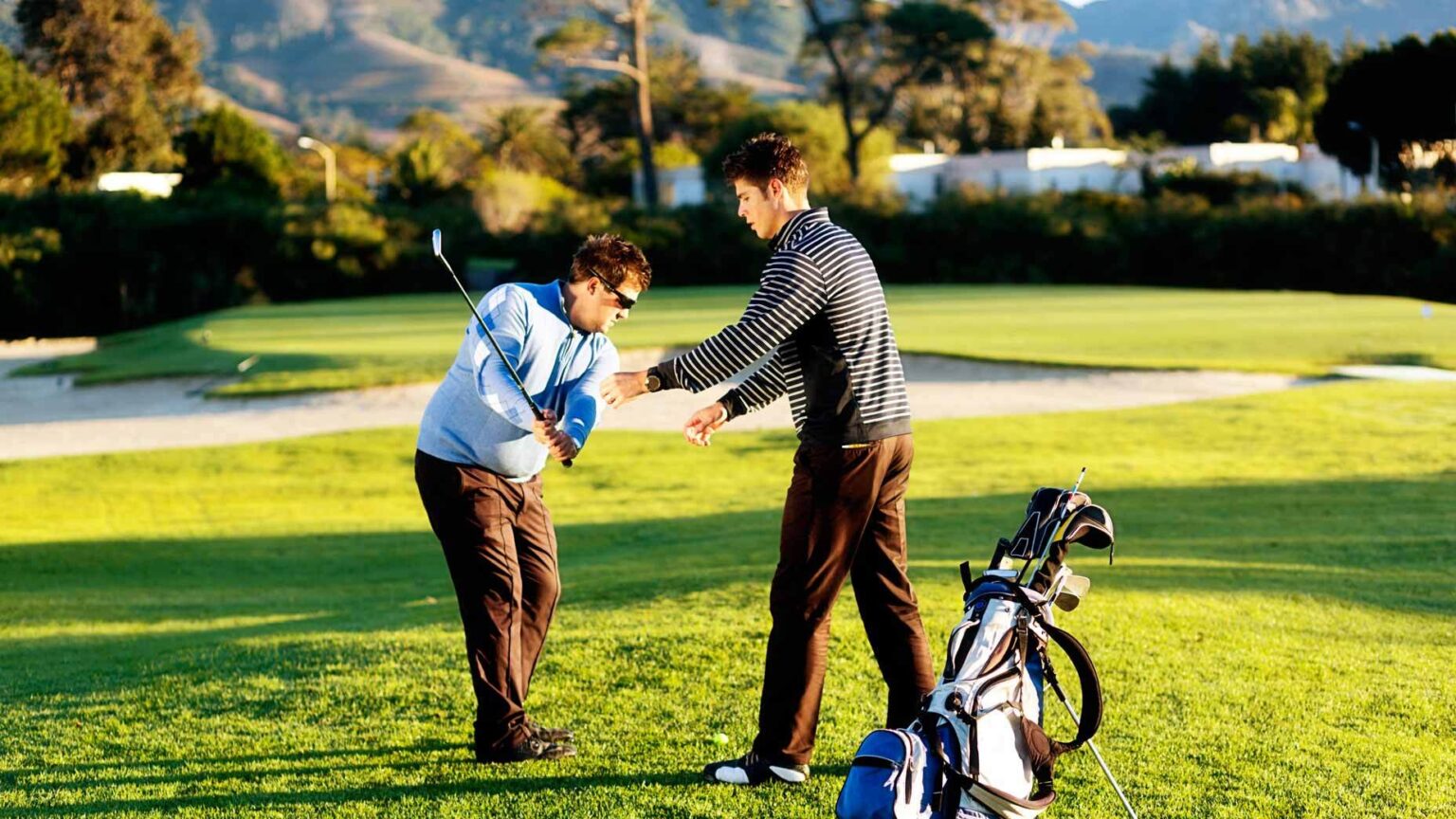 golf teacher giving lesson