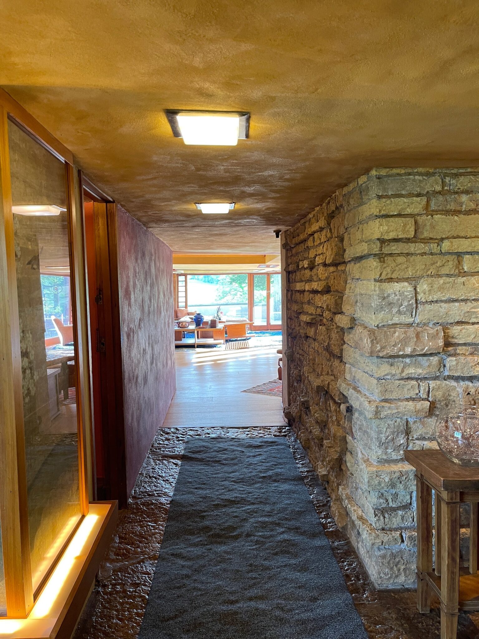 Hallway with stone walls leading