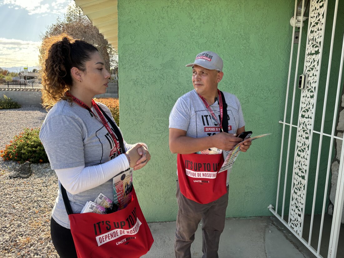 Nancy Chavez Florez and Mauricio Baena, a kitchen worker and food runner, are members of the Culinary Workers Union. They have been knocking on doors in Latino and minority neighborhoods in Las Vegas in support of Vice President Harris.