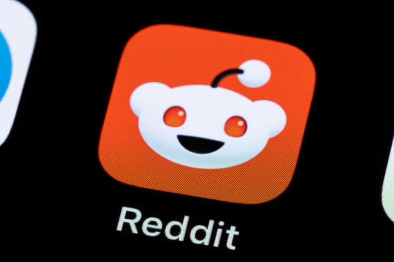 The Reddit application can be seen on the display of a smartphone.