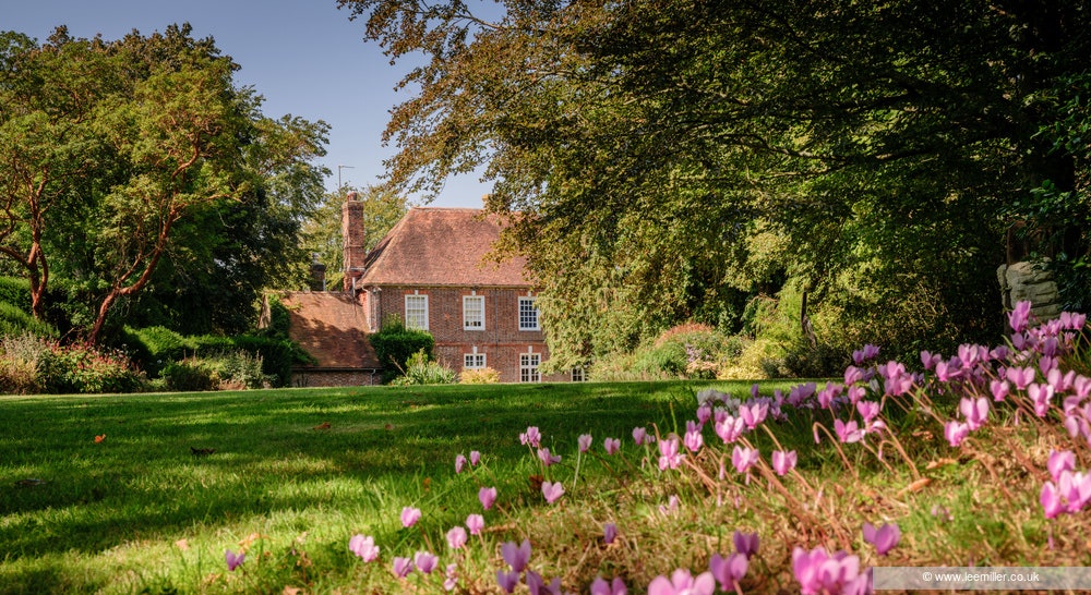 Image may contain Grass Plant Vegetation Architecture Building Housing Outdoors Tree House Manor Lawn and Cottage