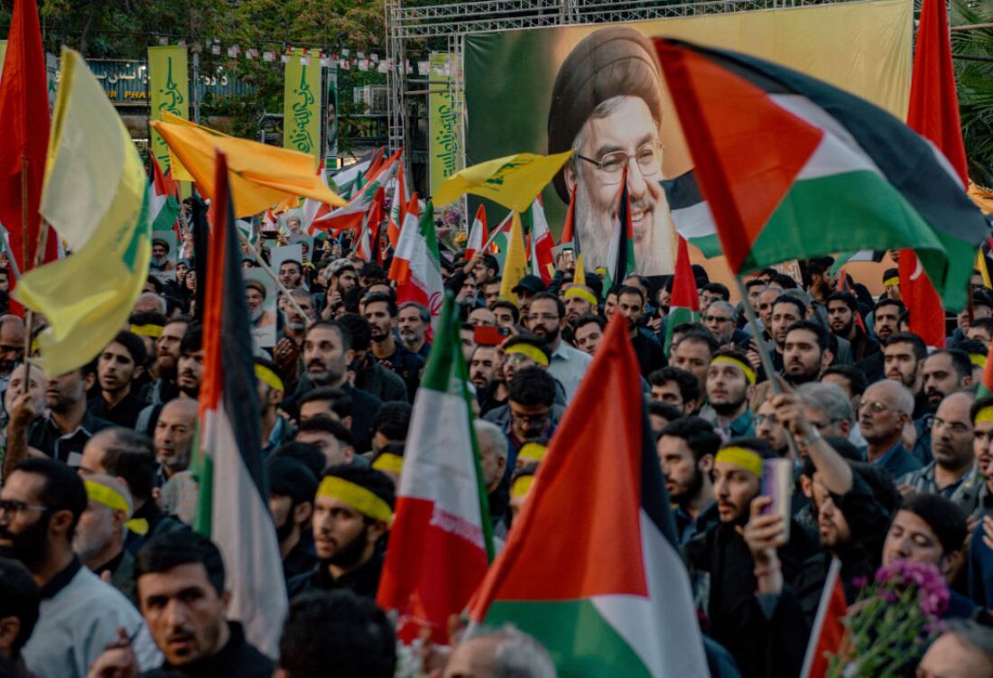 Iranians hold pictures of Hezbollah leader Hassan Nasrallah, who was killed in an Israeli air strike on Beirut's southern suburbs on Sept. 27, during an anti-Israel protest in Palestine Square in Tehran on Sept. 30.