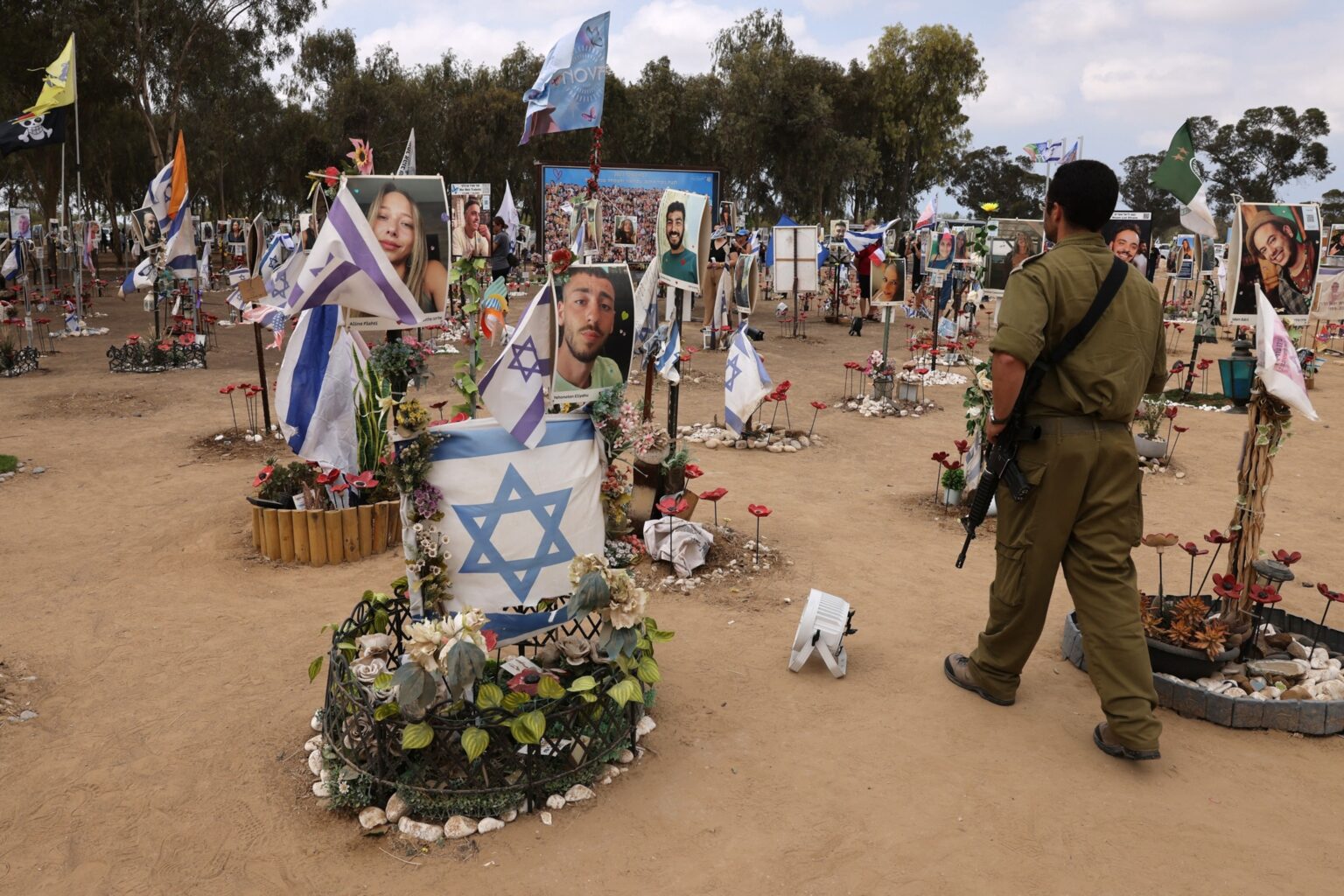 PHOTO: An Israeli soldier visits an installation honoring those who were killed and kidnapped during the October 7 attacks by Palestinian militants, at the site of the festival near Kibbutz Reim in southern Israel, Oct. 6, 2024.