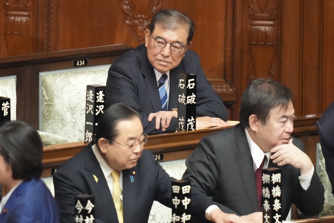 Shigeru Ishiba, top, sits ahead of the extraordinary session of parliament's lower house Tuesday, Oct. 1, 2024, in Tokyo.