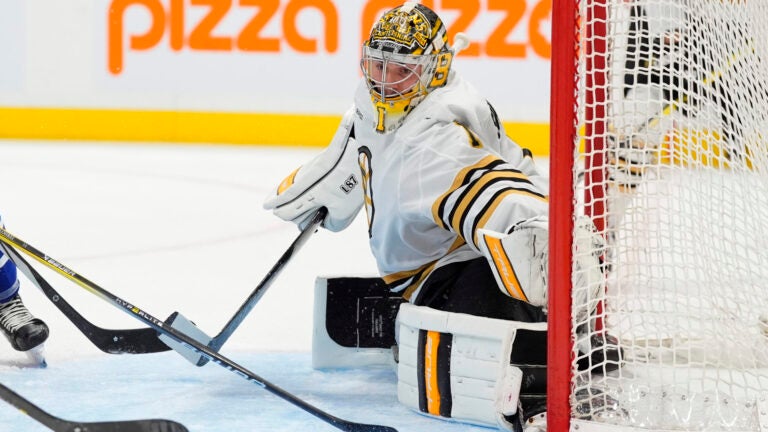 Boston Bruins goaltender Jeremy Swayman (1) covers the post as the puck goes wide against the Toronto Maple Leafs during the second period of an NHL hockey game in Toronto, Monday, March 4, 2024.