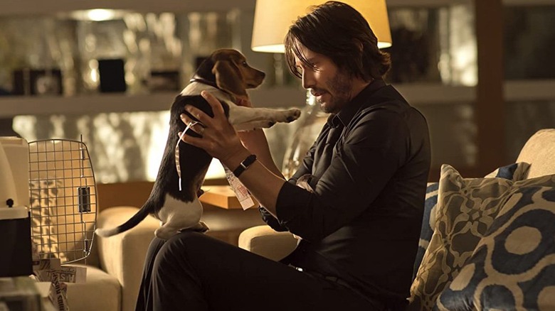 John Wick holding Daisy first John Wick movie