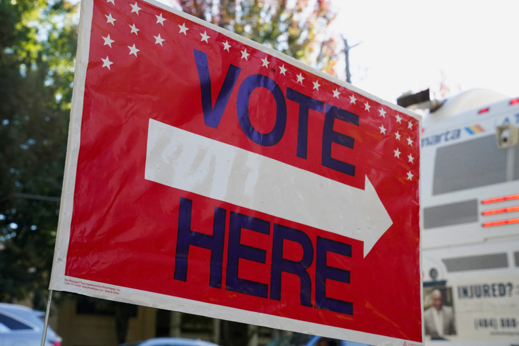 Georgians turned out a day after the battleground state opened early voting