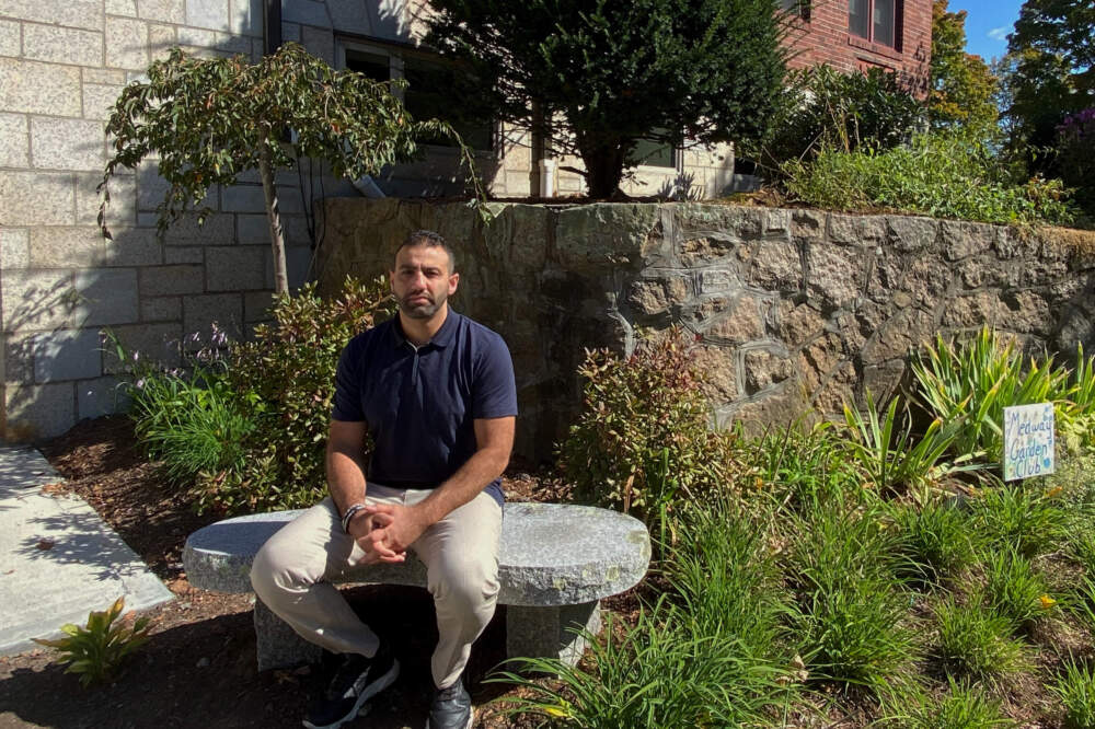 Abood Okal outside a library in Medway. (Deborah Becker/WBUR)