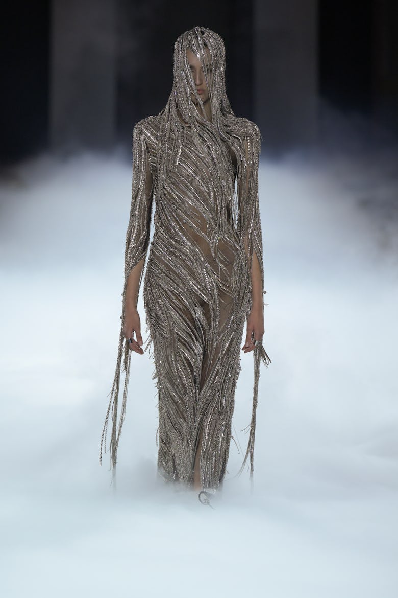 Model on the runway at Alexander McQueen RTW Spring 2025 as part of Paris Ready to Wear Fashion Week...