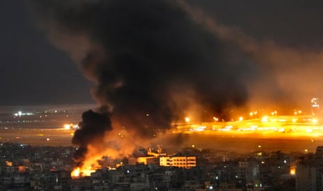 Flames and smoke rise form an Israeli airstrike on Dahiyeh, in the southern suburbs of Beirut on Sunday.