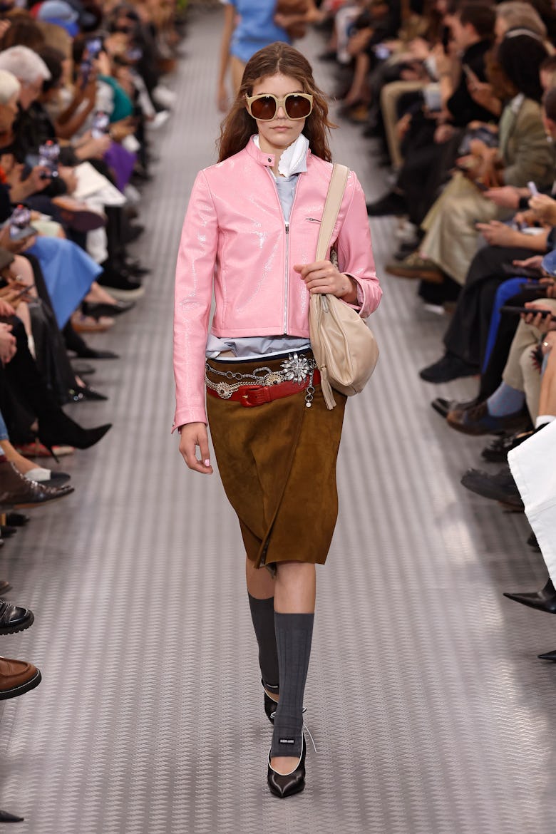 A model walks the runway during the Miu Miu Paris Womenswear Spring-Summer 2025 show as part of Pari...