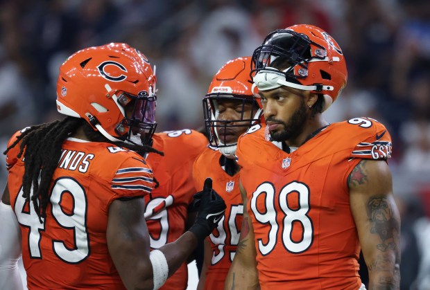 Bears defensive end Montez Sweat (98) talks with linebacker Tremaine Edmunds (49) during a break in the third quarter against the Texans on Sept. 15, 2024, at NRG Stadium in Houston. (John J. Kim/Chicago Tribune)