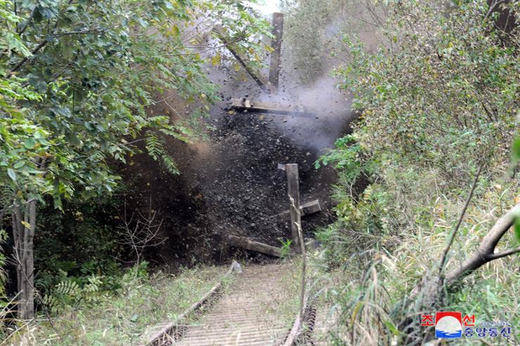 This photo, provided by North Korea's official Korean Central News Agency on Oct. 17, shows the North's blowing up of part of the Donghae Line road along the east coast on Oct. 15, in retaliation for the South's alleged drone provocations. Yonhap