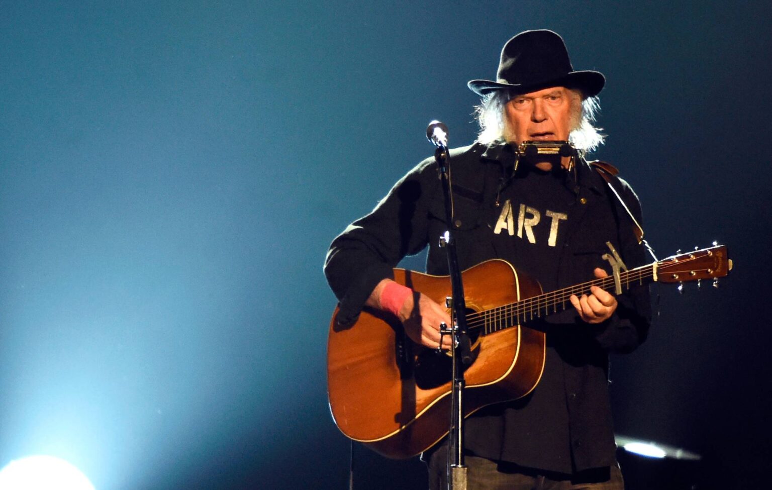 Neil Young performs onstage at the 25th anniversary MusiCares 2015 Person Of The Year Gala. (Photo by Frazer Harrison/Getty Images)