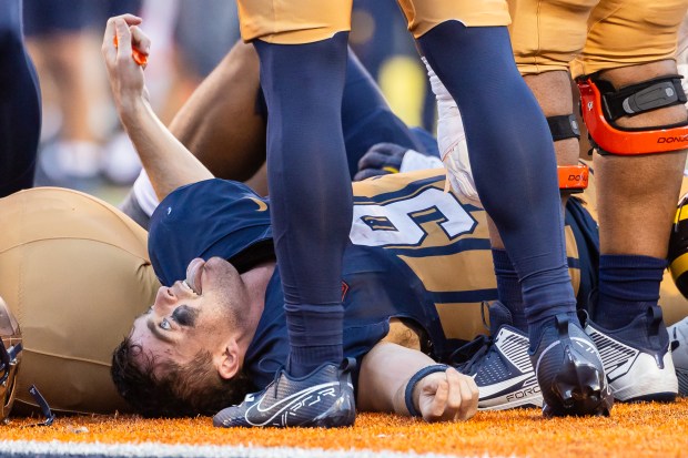 Illinois quarterback Luke Altmyer celebrates after scoring a touchdown against Michigan in the fourth quarter on Oct. 19, 2024, in Champaign. The Illini won 21-7. (Michael Hickey/Getty)