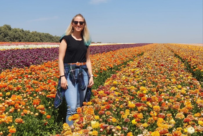 Doron Steinbrecher standing in a flower plantation in southern Israel