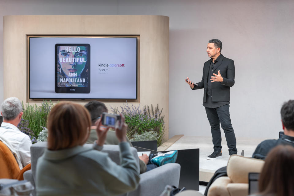 Panos Panay onstage at Amazon's Kindle launch event 2024, with a big screen to his right showing the new Kindle Colorsoft and its price.