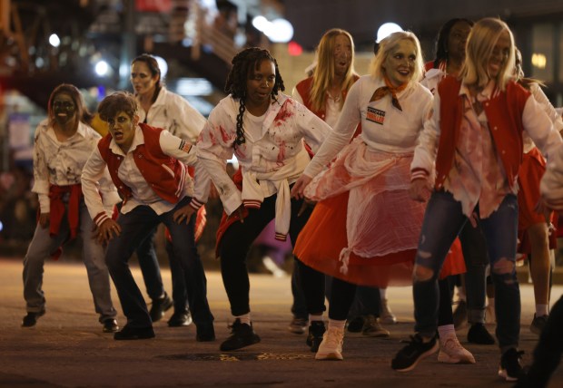 A group called Chicago Thriller dance while marching in the Arts in the Dark Halloween Parade on State Street. (John J. Kim/Chicago Tribune)