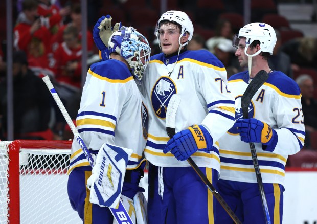 Buffalo Sabres goaltender Ukko-Pekka Luukkonen (1), center Tage Thompson (72), and defenseman Mattias Samuelsson (23), celebrate after a victory over the Chicago Blackhawks at the United Center in Chicago on Oct. 19, 2024. (Chris Sweda/Chicago Tribune)