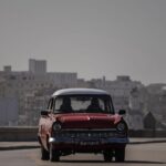 An American classic car and bicycle share the road on the Malecon amid a cloud of Sahara dust in Havana, Cuba, Thursday, June 25, 2020.  - Sputnik International, 1920, 20.10.2024