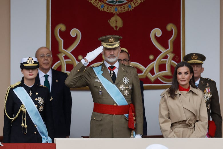 King Felipe VI of Spain (C) salutes flanked by his daughter Crown Princess Leonor (L) and his wife Q...