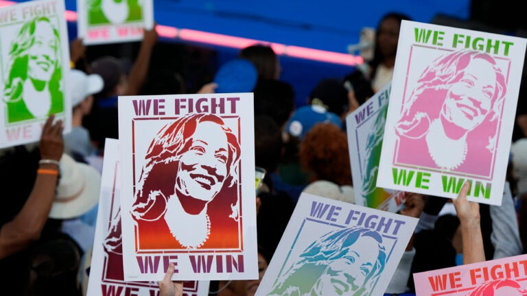 Attendees display signs for Democratic presidential nominee Vice President Kamala Harris during a campaign rally in Clarkston, Ga.