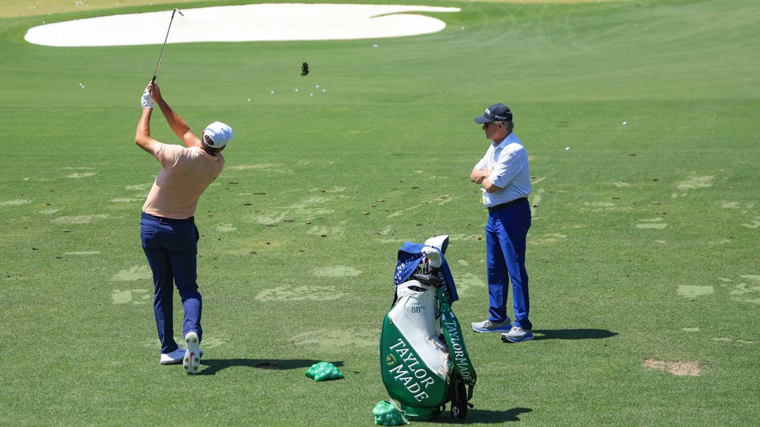 Scottie Scheffler and coach Randy Smith on the range at the Masters.