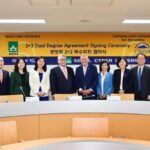 Seoul Cyber University President Lee Eun-joo, fifth from left, poses with Lee Sang-kyun, sixth from left, chairperson of the Shinil Education Foundation, and California State University of San Bernardino President Tomas D. Morales, seventh from left,  after signing a dual degree agreement at the university in Seoul, Oct. 10. Courtesy of Seoul Cyber University