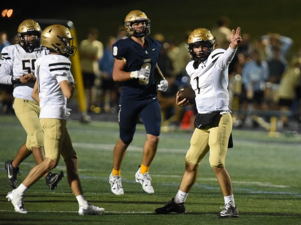 Richards' Noah Escobedo (7) signals his first down during a 4th quarter drive against Lemont during a South Suburban Conference game Friday, Oct. 11, 2024 in Lemont, IL. (Steve Johnston/for the Daily Southtown)