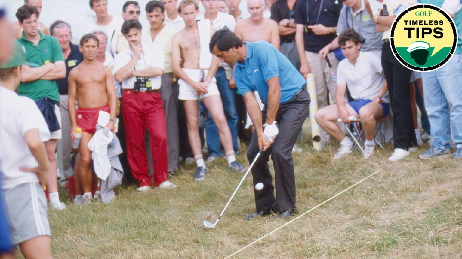 seve ballesteros hits a pitch shot in front of a crowd of people