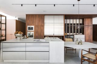 A kitchen with gray flooring and gray countertop