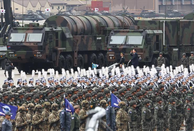 President Yoon Suk Yeol passes by a transporter erector launcher carrying the Hyunmoo-5 ballistic missile during a ceremony marking Armed Forces Day, Oct. 1, at Seoul Air Base in Seongnam, just south of the capital. Yonhap