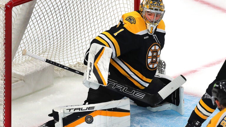 Bruins goaltender Jeremy Swayman makes a pad save in the first period.