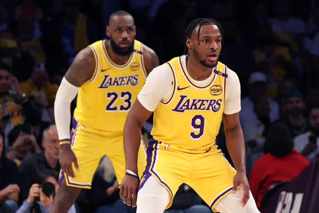 LeBron James #23 and Bronny James #9 of the Los Angeles Lakers play during the second quarter against the Minnesota Timberwolves at LA's Crypto.com Arena on Tuesday.