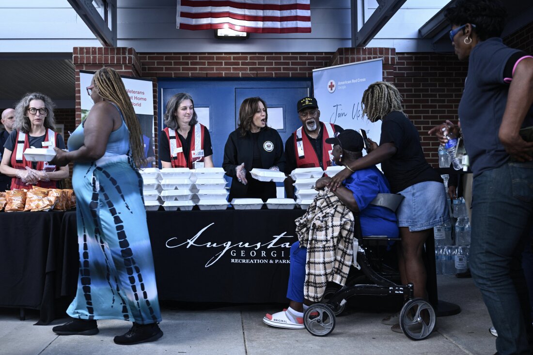 Vice President Harris hands out food to people at the Henry Brigham Community Center in Augusta, Ga., on Oct. 2, 2024 during a tour of hurricane damage in the area.