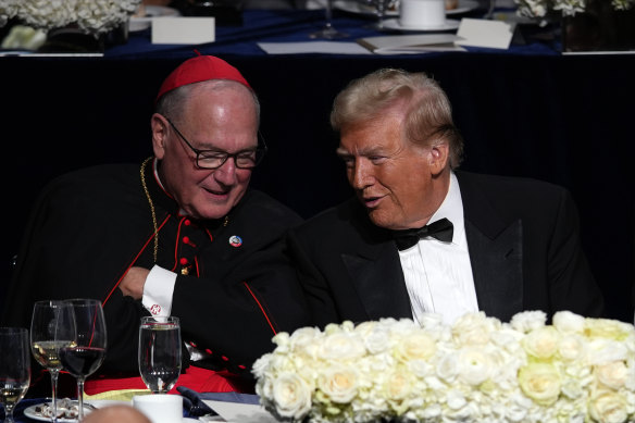 Donald Trump talks with Cardinal Timothy Dolan at last week’s white-tie charity dinner in New York.