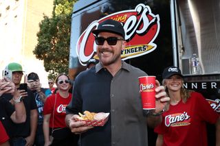 Travis Kelce serves up Raising Cane's at 2nd Annual Kelce Car Jam in Kansas City on October 05, 2024 in Kansas City, Missouri.